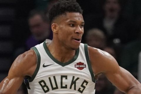 Milwaukee Bucks' Giannis Antetokounmpo reacts after a dunk during the second half of an NBA basketball game against the Portland Trail Blazers Thursday, Nov. 21, 2019, in Milwaukee. The Bucks won 137-129. (AP Photo/Morry Gash)