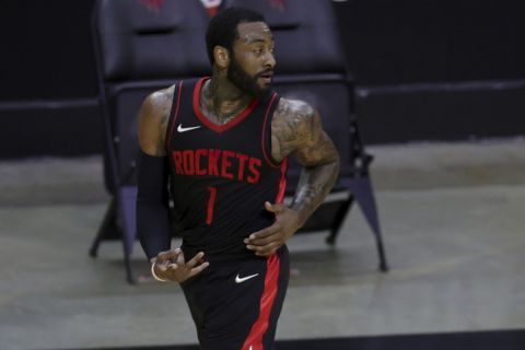 John Wall, of the Houston Rockets, reacts to a three point basket against the Los Angeles Clippers during the first quarter of an NBA basketball game, Friday, April 23, 2021, in Houston. (Carmen Mandato/Pool Photo via AP)