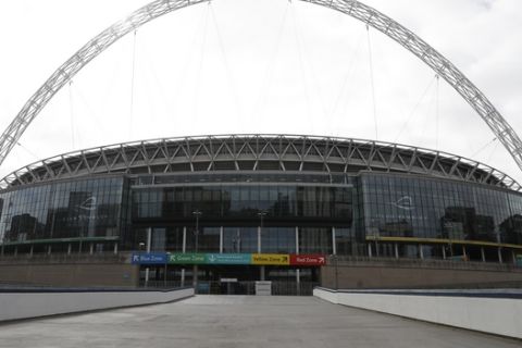 A general view of Wembley Stadium in London, Tuesday, March 17, 2020. UEFA has formally proposed postponing the 2020 European Championship for one year because of the coronavirus outbreak. The Norwegian soccer association says the new tournament dates will be June 11 to July 11. (AP Photo/Alastair Grant)