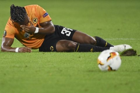 Wolverhampton Wanderers' Adama Traore reacts during the Europa League quarterfinal match between Wolverhampton Wanderers and Sevilla at the MSV-Arena in Duisburg, Germany, Tuesday, Aug. 11, 2020. (Ina Fassbender/Pool Photo via AP)