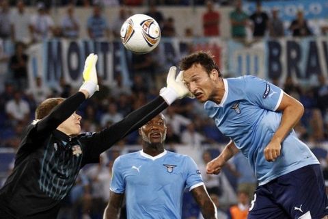FC Vaslui's goalkeeper Vytautas Cerniauskas (L) makes a save against SS Lazio's Libor Kozak during their Europa League soccer match at the Olympic stadium in Rome September 15, 2011. REUTERS/Max Rossi  (ITALY - Tags: SPORT SOCCER)