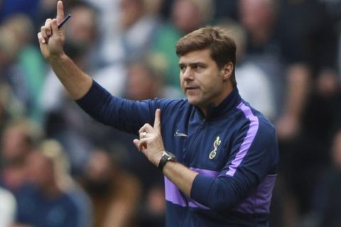 Tottenham's manager Mauricio Pochettino gives directions to his players during the English Premier League soccer match between Tottenham Hotspur and Southampton at the White Heart Lane stadium in London, Saturday, Sept. 28, 2019. (AP Photo/Ian Walton)