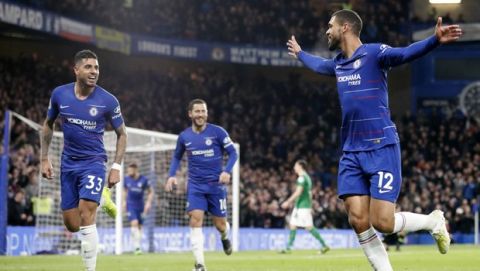 Chelsea's Ruben Loftus-Cheek, right, celebrates with teammates Eden Hazard, center, and Emerson, left, after scoring his sides third goal during the English Premier League soccer match between Chelsea and Brighton & Hove Albion at Stamford Bridge stadium in London, Wednesday, April 3, 2019. (AP Photo/Frank Augstein)