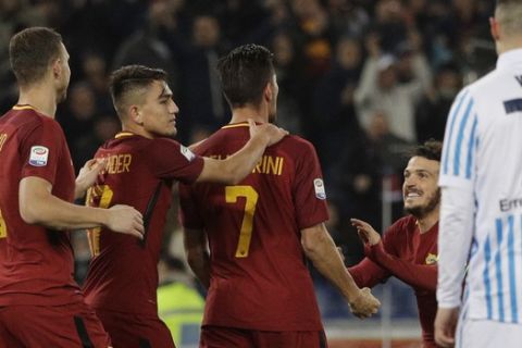 Roma's Lorenzo Pellegrini, third from right, celebrates with teammates after scoring his side's third goal during an Italian Serie A soccer match between AS Roma and Spal, at the Olympic stadium in Rome, Friday, Dec. 1st, 2017. (AP Photo/Gregorio Borgia)