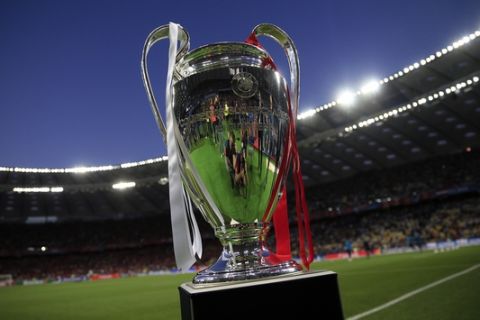 The trophy is displayed on the field before the Champions League Final soccer match between Real Madrid and Liverpool at the Olimpiyskiy Stadium in Kiev, Ukraine, Saturday, May 26, 2018. (AP Photo/Pavel Golovkin)