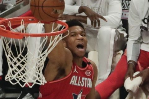 Giannis Antetokounmpo of the Milwaukee Bucks dunks during the first half of the NBA All-Star basketball game Sunday, Feb. 16, 2020, in Chicago. (AP Photo/David Banks)