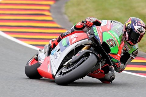 German MotoGP rider Stefan Bradl of the Aprilia Racing Team Gresini goes on the course during the second free training for the race on the Sachsenring in Hohenstein-Ernstthal, Germany, Friday, July 15, 2016. (Jan Woitas/dpa via AP)