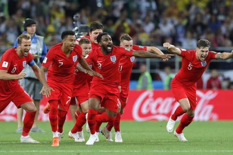 England's players celebrate after defeated Colombia in a penalty shoot out during the round of 16 match between Colombia and England at the 2018 soccer World Cup in the Spartak Stadium, in Moscow, Russia, Tuesday, July 3, 2018. (AP Photo/Ricardo Mazalan)