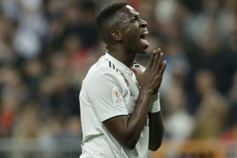Real forward Vinicius Junior reacts after a missed scoring opportunity during the Copa del Rey semifinal second leg soccer match between Real Madrid and FC Barcelona at the Bernabeu stadium in Madrid, Spain, Wednesday Feb. 27, 2019. (AP Photo/Andrea Comas)