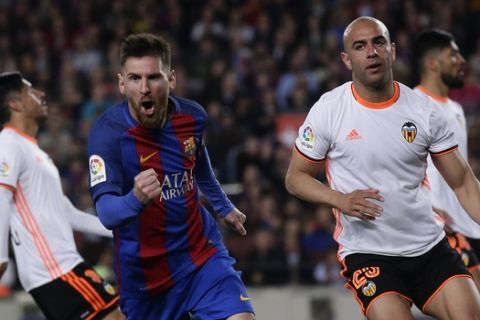 FC Barcelona's Lionel Messi, center, celebrates after scoring a goal during the Spanish La Liga soccer match between FC Barcelona and Valencia at the Camp Nou stadium in Barcelona, Spain, Sunday, March 19, 2017. (AP Photo/Manu Fernandez)