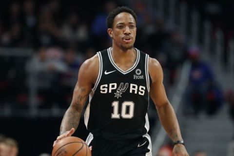 San Antonio Spurs guard DeMar DeRozan brings the ball up court during the first half of an NBA basketball game, Monday, Jan. 7, 2019, in Detroit. (AP Photo/Carlos Osorio)