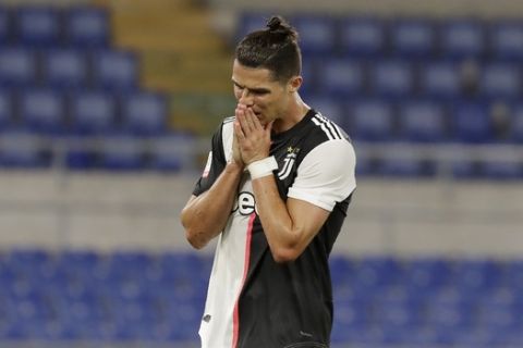 Juventus' Cristiano Ronaldo reacts after missing a scoring chance during the Italian Cup soccer final match between Napoli and Juventus, at Rome's Olympic Stadium, Wednesday, June 17, 2020. (AP Photo/Andrew Medichini)