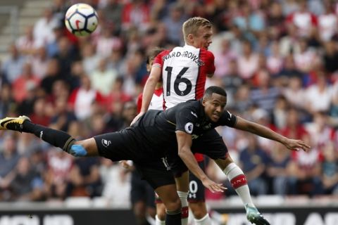 Southampton's James Ward-Prowse, top, and Swansea City's Wayne Routledge battle for the ball during the English Premier League soccer match at St Mary's Stadium, Southampton, England, Saturday, August 12, 2017. (Paul Harding(/PA via AP)