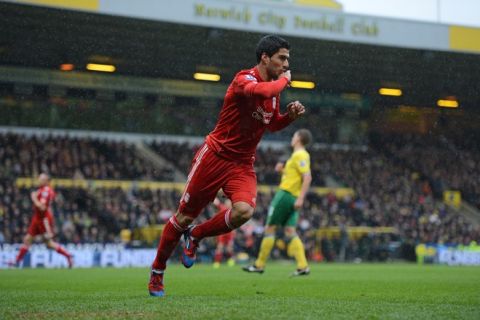 Liverpool's Uruguayan striker Luis Suarez celebrates scoring his first goal during the English Premier League football match between Norwich City and Liverpool at Carrow Road stadium in Norwich, England on April 28, 2012. AFP PHOTO/ADRIAN DENNIS

RESTRICTED TO EDITORIAL USE. No use with unauthorized audio, video, data, fixture lists, club/league logos or live services. Online in-match use limited to 45 images, no video emulation. No use in betting, games or single club/league/player publications.ADRIAN DENNIS/AFP/GettyImages