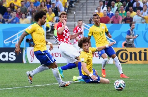 SAO PAULO, BRAZIL - JUNE 12: Marcelo (L) and David Luiz of Brazil watch as a ball is deflected into the net in the first half during the 2014 FIFA World Cup Brazil Group A match between Brazil and Croatia at Arena de Sao Paulo on June 12, 2014 in Sao Paulo, Brazil.  (Photo by Adam Pretty/Getty Images)