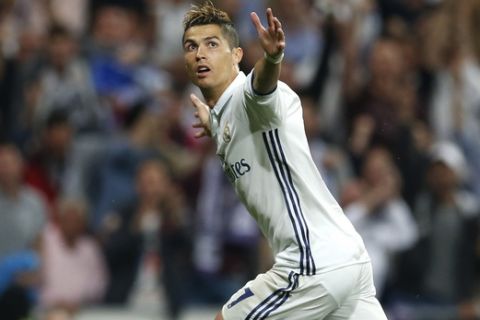 Real Madrid's Cristiano Ronaldo celebrates scoring his side's 2nd goal during the Champions League semifinal first leg soccer match between Real Madrid and Atletico Madrid at the Santiago Bernabeu stadium in Madrid, Spain, Tuesday, May 2, 2017. (AP Photo/Francisco Seco)