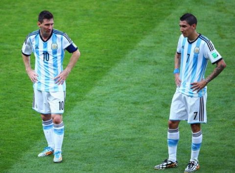BELO HORIZONTE, BRAZIL - JUNE 21: Lionel Messi (L) and Angel di Maria of Argentina look on during the 2014 FIFA World Cup Brazil Group F match between Argentina and Iran at Estadio Mineirao on June 21, 2014 in Belo Horizonte, Brazil.  (Photo by Ian Walton/Getty Images)