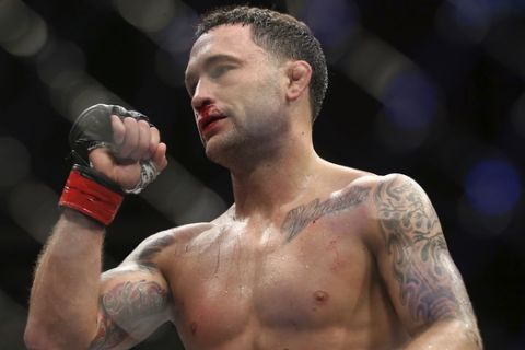 Frankie Edgar celebrates his win over Cub Swanson during the third round of their UFC mixed martial arts featherweight bout early Sunday, April 22, 2018, in Atlantic City, N.J. (AP Photo/Mel Evans)