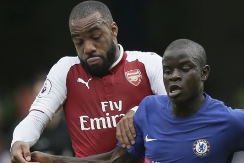 Arsenal's Alexandre Lacazette, left, and Chelsea's N'Golo Kante vie for the ball during the English Premier League soccer match between Chelsea and Arsenal at Stamford Bridge stadium in London, Sunday, Sept. 17, 2017. (AP Photo/Tim Ireland)