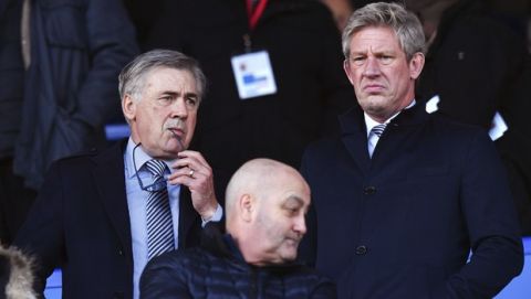 Everton's new manager Carlo Ancelotti, left, and director of football Marcel Brands in the stands during the English Premier League soccer match between Everton and Arsenal at Goodison Park, Liverpool, England, Saturday, Dec. 21, 2019. (Anthony Devlin/PA via AP)