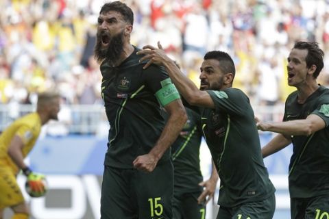 Australia's Mile Jedinak celebrates scoring his side's opening goal during the group C match between Denmark and Australia at the 2018 soccer World Cup in the Samara Arena in Samara, Russia, Thursday, June 21, 2018. (AP Photo/Gregorio Borgia)