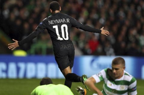 PSG's Neymar, rear, celebrates after scoring the opening goal during the Champions League Group B soccer match between Celtic and Paris St. Germain at the Celtic Park stadium in Glasgow, Scotland, Tuesday, Sept. 12, 2017. (AP Photo/Scott Heppell)