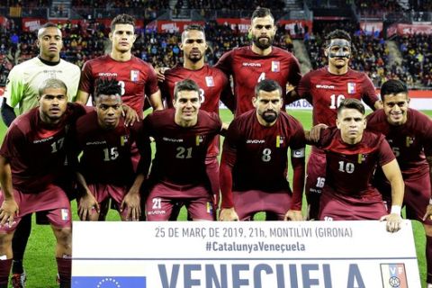 Venezuela players pose prior to a friendly soccer match between Catalonia and Venezuela at the Montilivi stadium in Girona, Spain, Monday, March 25, 2019. (AP Photo/Manu Fernandez)