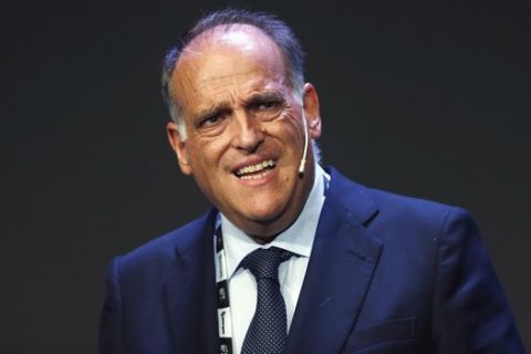FILE - In this Monday, Sept. 24, 2018 file photo, Javier Tebas, the president of the Spanish La Liga, speaks during the World Football summit in Madrid, Spain. As Spanish league president Tebas sees it, expanding internationally is the only way to keep the league competitive. La Liga competitive with the Premier League and other top leagues. (AP Photo/Paul White, file)