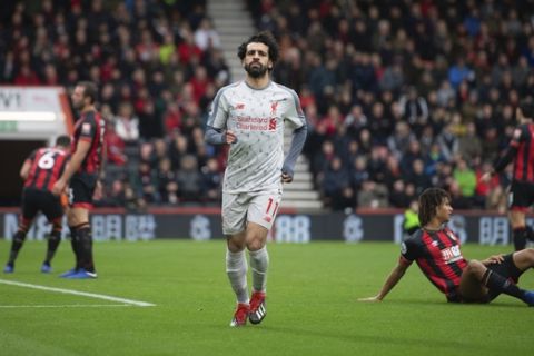 Liverpool's Mohamed Salah celebrates scoring his side's second goal of the game during their English Premier League soccer match against Bournemouth at the Vitality Stadium, Bournemouth, England, Saturday, Dec. 8, 2018. (Mark Pain/PA via AP)