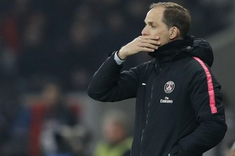PSG's coach Thomas Tuchel watches his team during the French League One soccer match between OSC Lille and Paris Saint-Germain at Stade Pierre Mauroy in Lille, France, Sunday, April 14, 2019.(AP Photo/Christophe Ena)