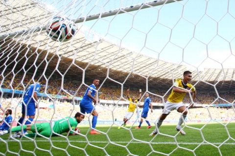BELO HORIZONTE, BRAZIL - JUNE 14: Teofilo Gutierrez of Colombia celebrates scoring his teams second goal against goalkeeper Orestis Karnezis of Greece during the 2014 FIFA World Cup Brazil Group C match between Colombia and Greece at Estadio Mineirao on June 14, 2014 in Belo Horizonte, Brazil.  (Photo by Paul Gilham/Getty Images)