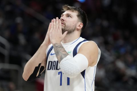 Dallas Mavericks guard Luka Doncic looks skyward after a shot during the second half of an NBA basketball game against the Detroit Pistons, Saturday, March 9, 2024, in Detroit. (AP Photo/Carlos Osorio)