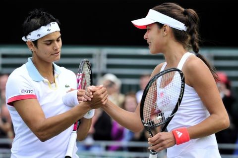 Serbian player Ana Ivanovic (R) reacts after beating German player Eleni Daniilidou during the women's single at the Wimbledon Tennis Championships at the All England Tennis Club, in southwest London on June 23, 2011. AFP PHOTO / GLYN KIRK
RESTRICTED TO EDITORIAL USE (Photo credit should read GLYN KIRK/AFP/Getty Images)