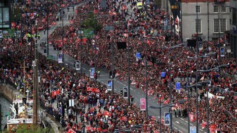 Liverpool soccer fans line the route for the Champions League Winners Parade in Liverpool, England, Sunday June 2, 2019.  Liverpool is champion of Europe for a sixth time after beating Tottenham 2-0 in the Champions League final played in Madrid Saturday. (Danny Lawson/PA via AP)