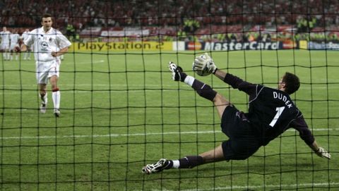 Liverpool's Jerzy Dudek saves from Andriy Shevchenko to win a penalty shootout at the end of the UEFA Champions League Final between AC Milan and Liverpool at the Ataturk Olympic Stadium in Turkey, Istanbul Wednesday May 25, 2005. Liverpool won 3-2 on penalties after the match finished 3-3 after extra time.  (AP Photo/Thomas Kienzle)