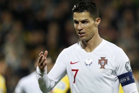 Portugal's Cristiano Ronaldo gestures during the Euro 2020 group B qualifying soccer match between Lithuania and Portugal at LFF stadium in Vilnius, Lithuania, Tuesday, Sept. 10, 2019. (AP Photo/Mindaugas Kulbis)