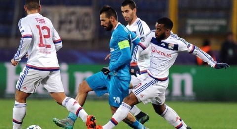 Lyon's French forward Alexandre Lacazette (R) vies for the ball with Zenit's Portuguese midfielder Miguel Danny (C) during the UEFA Champions League group H football match between FC Zenit and Olympique Lyonnais at the Petrovsky stadium in St. Petersburg on October 20, 2015. AFP PHOTO / OLGA MALTSEVA        (Photo credit should read OLGA MALTSEVA/AFP/Getty Images)