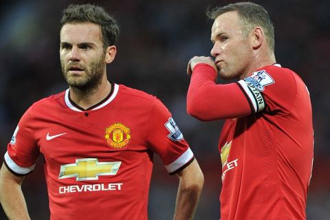 12 August 2014 Friendly Football Match - Manchester United v Valencia 
Wayne Rooney & Juan Mata stand over the ball at a United free kick.

Photo: Steve Parkin