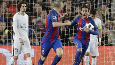 Barcelona's Neymar celebrates after PSG's Layvin Kurzawa scored an own goal during the Champions League round of 16, second leg soccer match between FC Barcelona and Paris Saint Germain at the Camp Nou stadium in Barcelona, Spain, Wednesday March 8, 2017. (AP Photo/Emilio Morenatti)