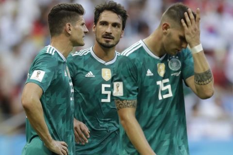 Germany's Mario Gomez, Mats Hummels and Niklas Suele, from left, react after Germany was eliminated during the group F match between South Korea and Germany, at the 2018 soccer World Cup in the Kazan Arena in Kazan, Russia, Wednesday, June 27, 2018. (AP Photo/Michael Probst)