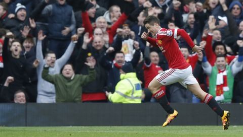 Manchester United's Ander Herrera reacts and celebrates after scoring his sides third goal of the game during the English Premier League soccer match between Manchester United and Arsenal at Old Trafford Stadium, Manchester, England, Sunday, Feb. 28, 2016. (AP Photo/Jon Super)  