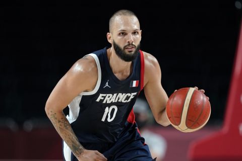 France's Evan Fournier (10) drives up court during a men's basketball quarterfinal round game against Italy at the 2020 Summer Olympics, Tuesday, Aug. 3, 2021, in Saitama, Japan. (AP Photo/Charlie Neibergall)