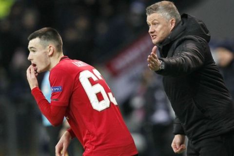 Manchester United's manager Ole Gunnar Solskjaer gives instructions from the side line during the Europa League Group L soccer match between Astana and Manchester United in Astana, Kazakhstan, Thursday, Nov. 28, 2019. (AP Photo/Stas Filippov)