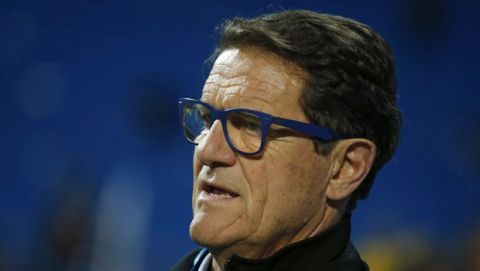 Former Real Madrid's coach Fabio Capello waits to be interviewed by a TV crew before a Spanish La Liga soccer match between Real Madrid and Las Palmas at the Santiago Bernabeu stadium in Madrid, Spain, Wednesday, March 1, 2017. (AP Photo/Paul White)