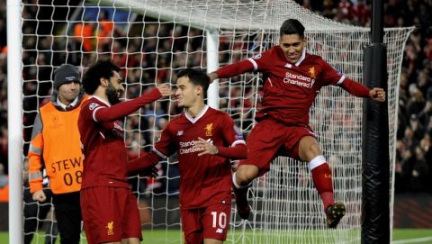 Liverpool's Philippe Coutinho, center, celebrates with his teammates after scoring his side's fifth goal during the Champions League Group E soccer match between Liverpool and Spartak Moscow at Anfield, Liverpool, England, Wednesday, Dec. 6, 2017. (AP Photo/Rui Vieira)