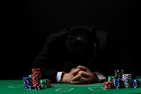 Sad man sitting in casino.