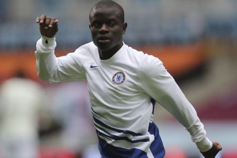 Chelsea's N'Golo Kante warms up ahead of the English Premier League soccer match between Aston Villa and Chelsea at the Villa Park stadium in Birmingham, England, Sunday, June 21, 2020. (Molly Darlington/Pool via AP)