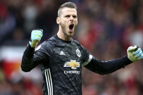Manchester United's goalkeeper David de Gea celebrates his sides third goal during the English Premier League soccer match between Manchester United and Chelsea at Old Trafford in Manchester, England, Sunday, Aug. 11, 2019. (AP Photo/Dave Thompson)
