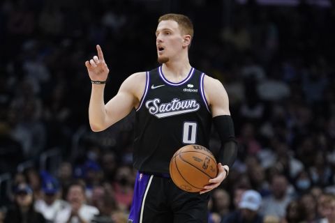 Sacramento Kings guard Donte DiVincenzo (0) dribbles during the second half of an NBA basketball game against the Los Angeles Clippers Saturday, April 9, 2022, in Los Angeles. (AP Photo/Marcio Jose Sanchez)
