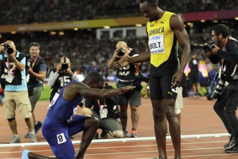 United States' Justin Gatlin bows to Jamaica's Usain Bolt after winning the Men's 100 meters final during the World Athletics Championships in London Saturday, Aug. 5, 2017. (AP Photo/Tim Ireland)